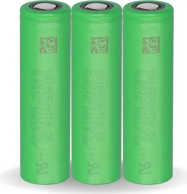 Three green cylindrical batteries are lined up side-by-side against a white background.