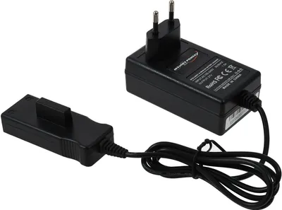 A black power adapter with a European plug and a separate charging connector are shown on a white background.
