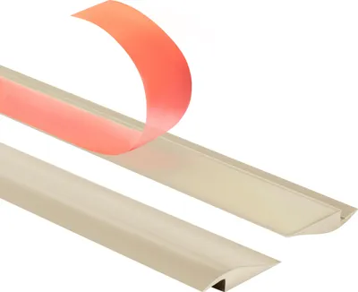 Two beige ramp profiles are shown against a white background. One profile has a strip of red adhesive backing peeling off.