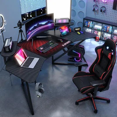 A gaming setup with a desk, chair, computer, and accessories.