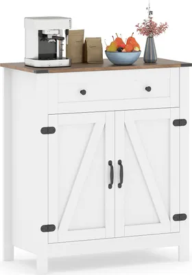 A white sideboard cabinet with a wooden top, featuring two cabinet doors with barn door style detailing and a single drawer. It is decorated with a coffee maker, bags of coffee, a bowl of fruit, and a vase with flowers.