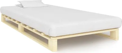 A white mattress on a wooden pallet bed frame, with two white pillows on the mattress.