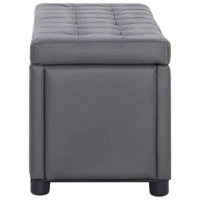 A studio shot of a gray ottoman with storage.