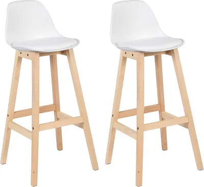Two white bar stools with wooden legs are shown against a white background.
