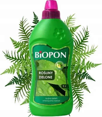 A bottle of Biopon liquid fertilizer for green plants, surrounded by fern leaves.