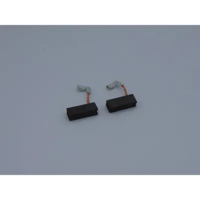 Two carbon brushes with copper wires and silver connectors are placed on a light gray background.