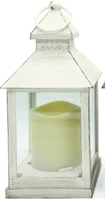 A white lantern with a cream LED candle inside, shown against a white background.
