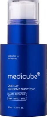 A blue bottle of Medicube skincare product with a pump dispenser.