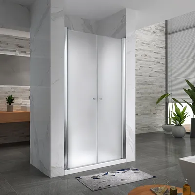 A modern bathroom with a frosted glass shower door.
