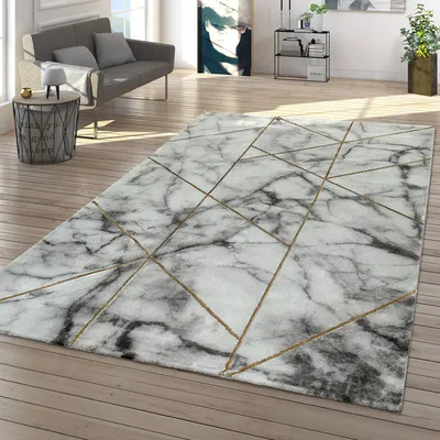 A modern living room with a marble-patterned rug, a sofa, and a side table.