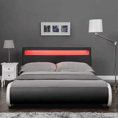 Produktbild von Corium® LED Polsterbett 'Valencia' mit Matratze - 140 x 200 cm - Schwarz Kunstleder - mit Lattenrost und RGB - Beleuchtung