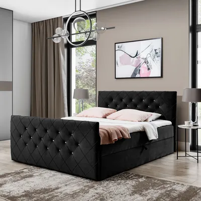 A bedroom scene featuring a black upholstered bed.