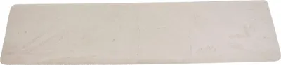 A long, rectangular, cream-colored table runner made of faux fur.