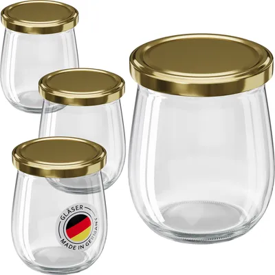 Four glass jars with gold screw-on lids are arranged on a white background. One jar in the foreground has a circular label with the German flag and text.