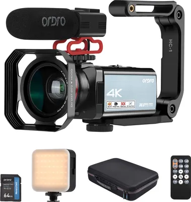 Produktbild von ORDRO HDR-AX10 4K Digitale Videokamera WiFi Camcorder DV-Recorder 3,5 Zoll IPS Touch Panel 30MP 30X Digitalzoom Gesichtserkennung IR Nachtsicht Anti-Shake mit Fernbedienung + Akku + Ladegeraet + 0,39X Weitwinkelobjektiv + Gegenlichtblende + externes Mikrofon + U-foermiger Kamerahalter + 64-GB-Speicherkarte + Mini-LED-Fuelllicht + grosser Aufbewahrungskoffer