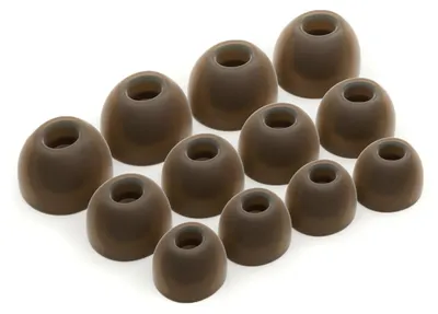 A collection of brown silicone ear tips for headphones, arranged in rows on a white background.