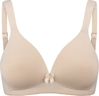 A studio shot of a beige bra against a white background.