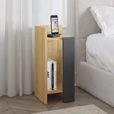 A modern nightstand next to a bed.
