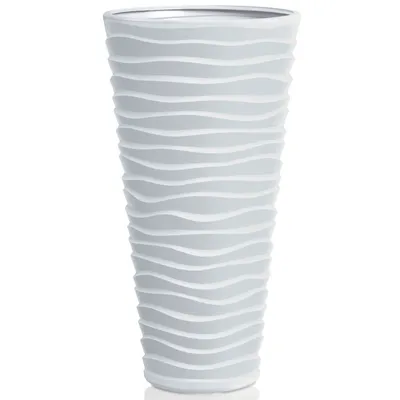 A tall, grey planter with a wavy pattern.