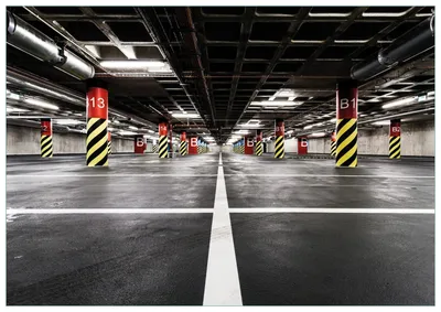Produktbild von Wallario Premium Glasbild, freischwebende Optik, kräftige Farben, Größe 100 x 70 cm Motiv Perspektive von unten leeres Parkhaus im Untergrund