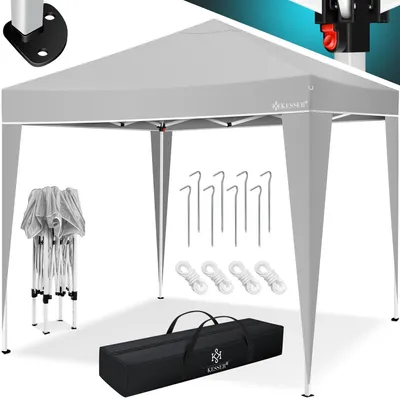 A gray pop-up canopy tent with its accessories laid out.