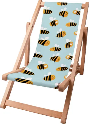 A wooden deck chair with a blue fabric seat featuring a pattern of cartoon bees.