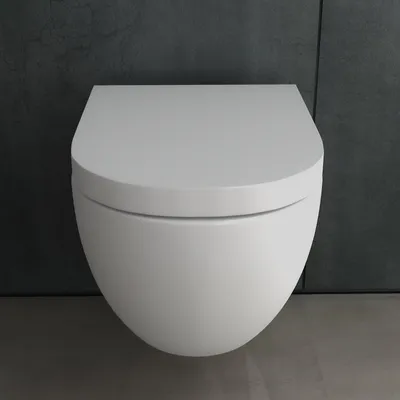 A white wall-mounted toilet against a dark gray tiled wall.