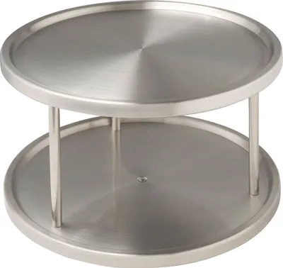 A two-tiered rotating organizer made of stainless steel.