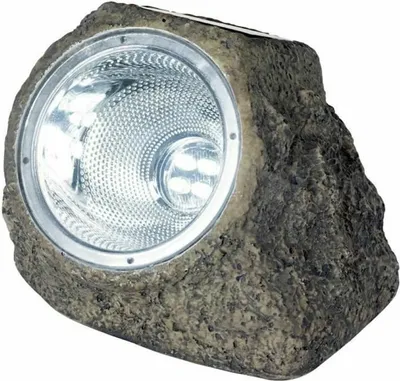 A solar-powered spotlight designed to look like a rock.