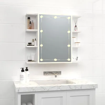A white bathroom medicine cabinet with an LED-lit mirror is mounted above a sink.