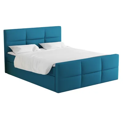 A blue upholstered boxspring bed with white bedding and pillows, shown from a side-angle on a white background.