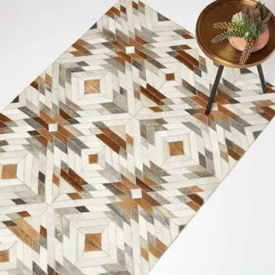 Produktbild von HOMESCAPES Patchwork Lederteppich 90 x 150 cm creme-grau-braun - Fellteppich Ethno-Muster