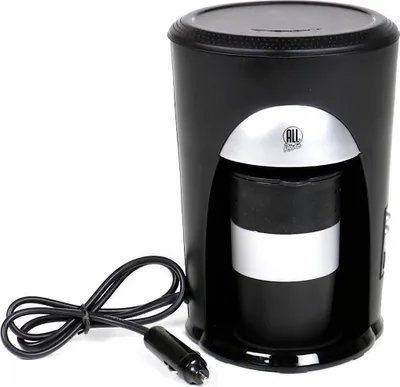 A black 24-volt coffee maker with a silver accent and a black cord with a car charger plug.
