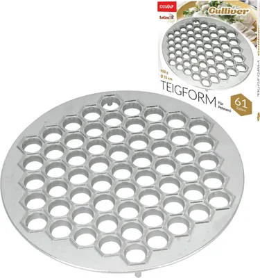 A product shot of a round metal dumpling mold with many hexagonal indentations, placed on a white background. A portion of the product's packaging is visible in the upper right corner.