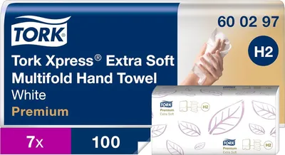 A product image for Tork Xpress Extra Soft Multifold Hand Towels, showing the packaging and a hand using a towel.