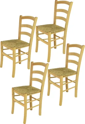 Four wooden chairs with woven seats are arranged in a studio setting against a white background.
