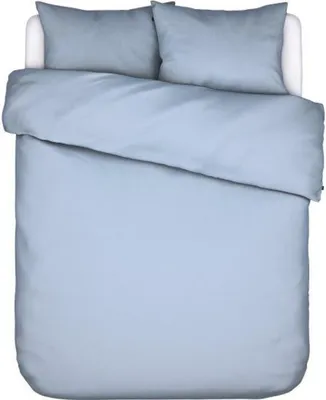 A top-down view of a neatly made bed with light blue bedding.