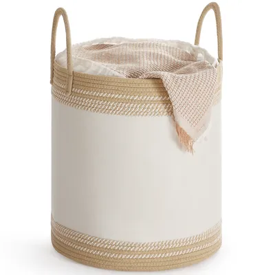A laundry basket filled with blankets.