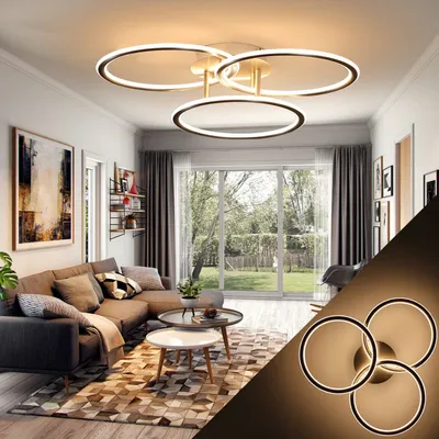 A modern living room with a sectional sofa, coffee tables, and a large window overlooking a garden. A contemporary ceiling light fixture is prominently displayed.