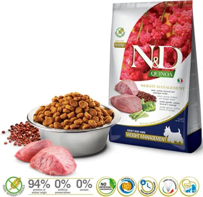 A bag of dog food and a bowl of dog food kibble are shown, along with raw meat and some quinoa. The bag has nutritional information and branding.