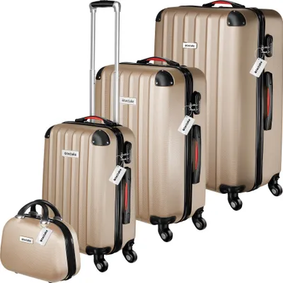 A set of four gold-colored suitcases and a beauty case are arranged diagonally on a white background.