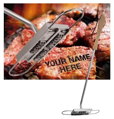 A steak branding iron with letters is shown being used on a steak on a grill.