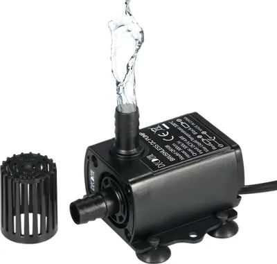 A black submersible water pump with water spraying from its outlet, next to a black filter attachment, on a white background.