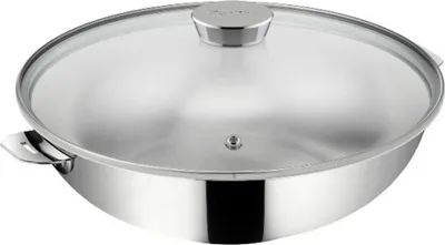 A stainless steel wok with a glass lid.