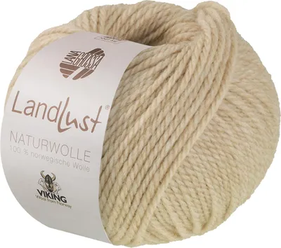 A ball of beige yarn with a label.