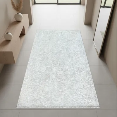 Imagen del producto de Alfombra color crema con un diseño abstracto de líneas, flecos y un estilo moderno. Tamaño: 80 x 150 cm