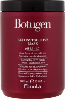A close-up of a burgundy colored hair mask jar with white text.