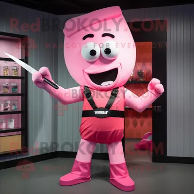 Productafbeelding van Roze messenwerper mascotte REDBROKOLY kostuum karakter gekleed met een T-shirt en strikjes