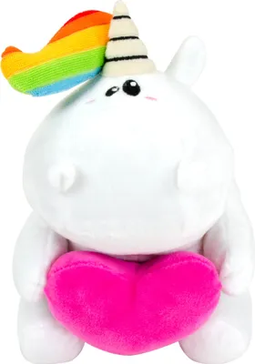A white plush unicorn with a rainbow mane and a pink heart is sitting and holding the heart.