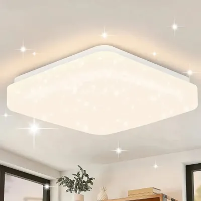 A square LED ceiling light with a star-like pattern is mounted on a white ceiling.